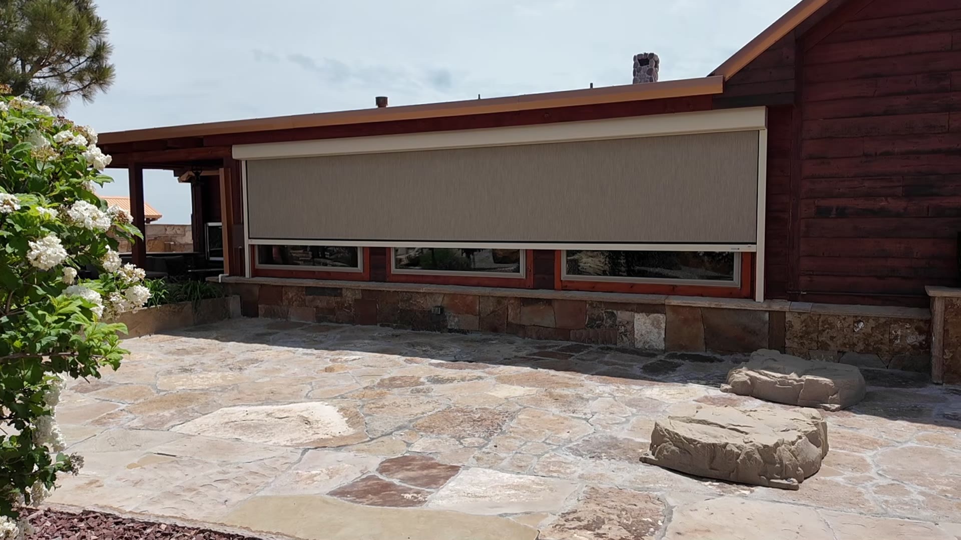 MagnaTrack screen over a flagstone patio