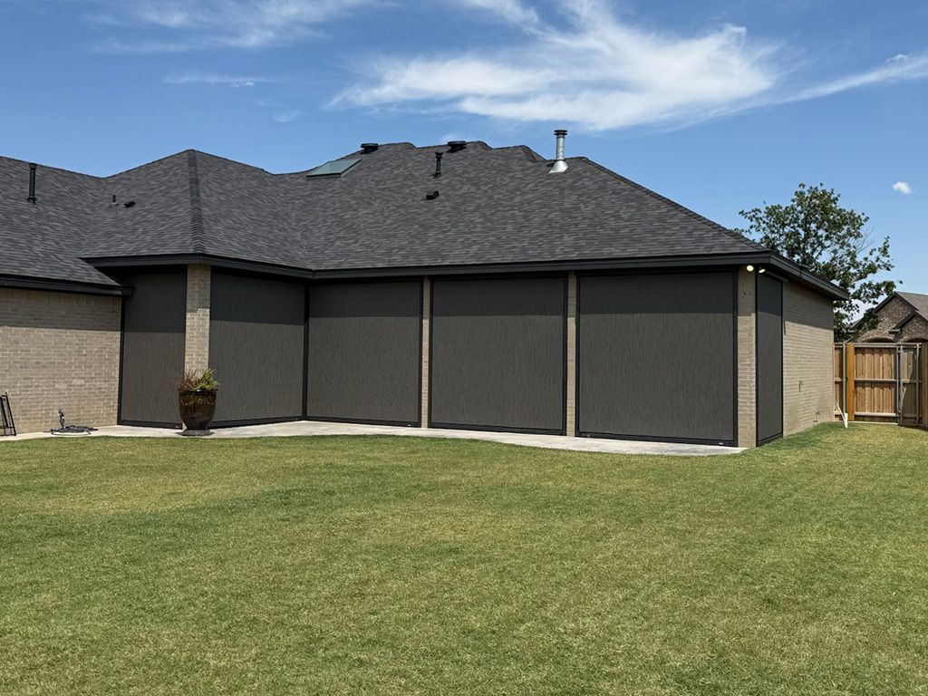 Patio screens on a brick home